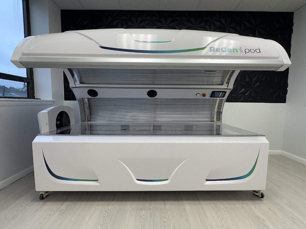 The ReGen Q8 full-body red light therapy pod, open and ready for a session.